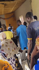 Community meeting held in Madalla, Nigeria with speaker and attendees
