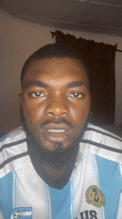 Man in striped jersey filmed indoors in Jos, Nigeria