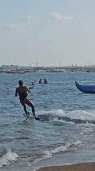 Kitesurfing session off the Bali coast on a clear morning