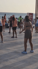 Outdoor Zumba class in full swing on Quarteira's beachfront