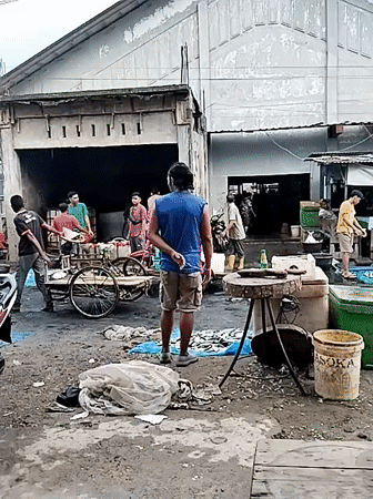 Early morning fish market bustles in Lhokseumawe, Indonesia