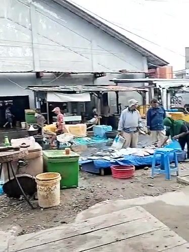 Early morning fish market bustles in Lhokseumawe, Indonesia