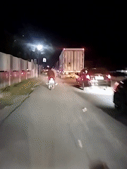 Nighttime traffic scene captured in Babahjurong, Indonesia