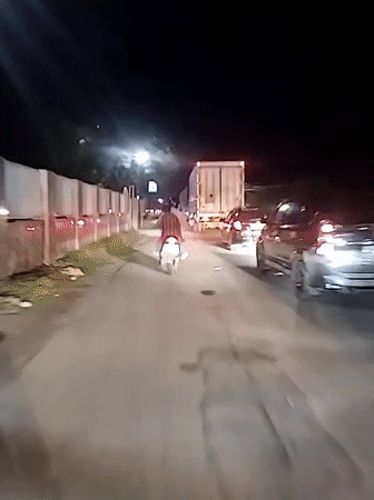 Nighttime traffic scene captured in Babahjurong, Indonesia