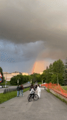 Rainbow over Tryokhgorny during a stormy summer afternoon