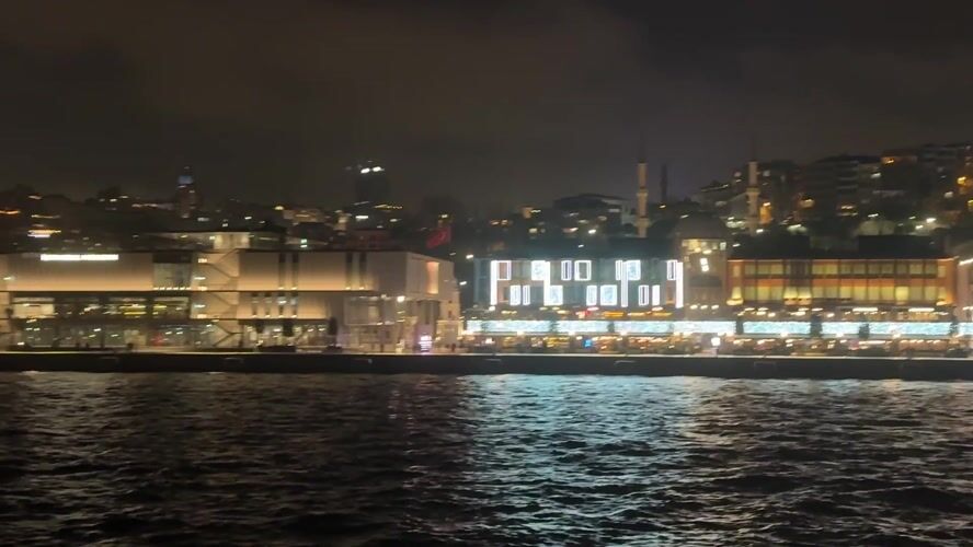 Evening waterfront activity captured near Istanbul Modern building