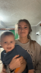 Woman and boy share dancing moment in Foki, Russia