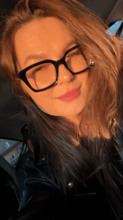 Woman photographed in car during afternoon in Izhevsk