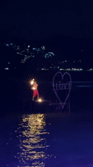 Fire dancers perform nighttime show on Thailand beach