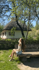 Woman visits Ukrainian folk architecture museum in Kyiv
