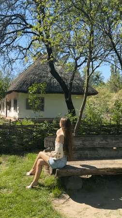Woman visits Ukrainian folk architecture museum in Kyiv