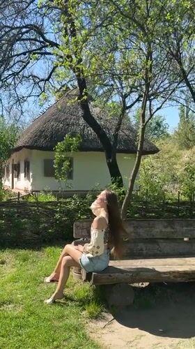 Woman visits Ukrainian folk architecture museum in Kyiv
