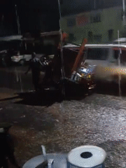 Heavy rain hits Nairobi streets, person with tuk-tuk spotted