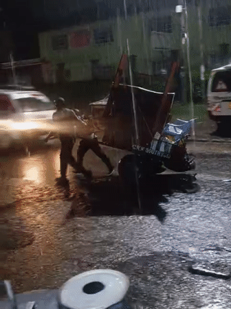 Heavy rain hits Nairobi streets, person with tuk-tuk spotted