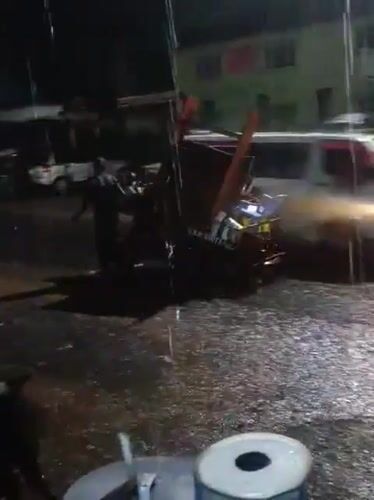 Heavy rain hits Nairobi streets, person with tuk-tuk spotted