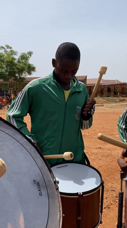 Youth groups perform drills and music at Nigerian field