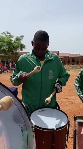 Youth groups perform drills and music at Nigerian field