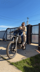 Father and child enjoy dirt bike ride in Prikamskii