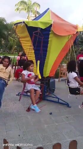 Outdoor carnival in full swing near a Caracas landmark