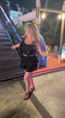 Blonde dancer performs on elevated platform at Nha Trang nightclub