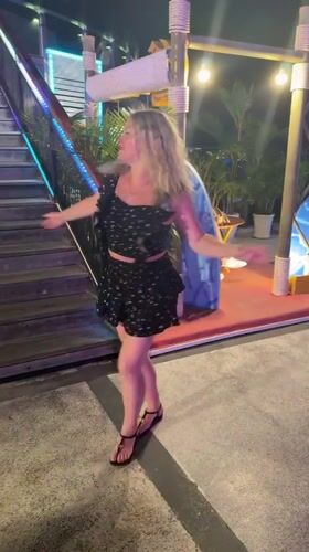 Blonde dancer performs on elevated platform at Nha Trang nightclub