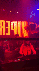 Women DJ and patron captured at Milan nightclub