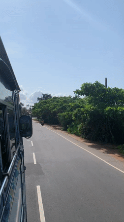 Early morning coastal road travel captured in Midigama, Sri Lanka