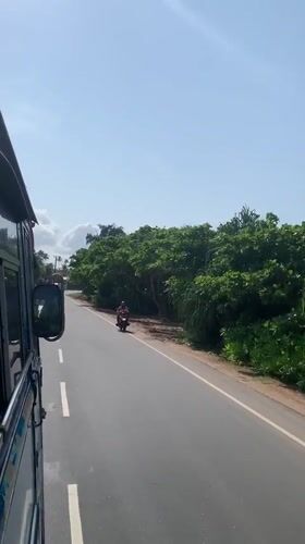 Early morning coastal road travel captured in Midigama, Sri Lanka