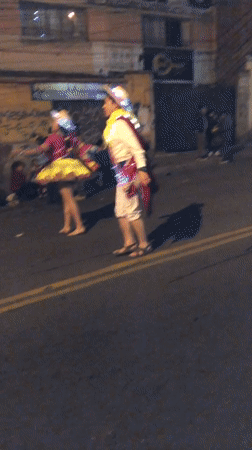 Traditional costumed parade fills La Paz streets at night
