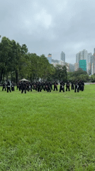 Martial arts group trains on Hong Kong field