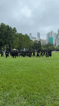 Martial arts group trains on Hong Kong field