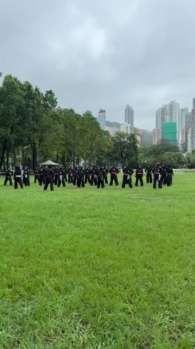 Martial arts group trains on Hong Kong field