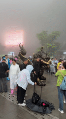 Foggy morning draws tourists to Zhangjiajie religious site