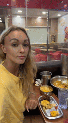 Diner films meal at Vietnamese Jollibee with buffet stations