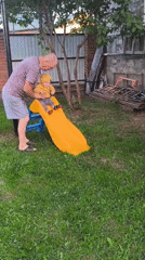 Family backyard gathering with baby, cooking, dog captured in Chaikovsky