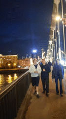Evening stroll along Moscow's illuminated riverside promenade
