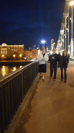 Evening stroll along Moscow's illuminated riverside promenade