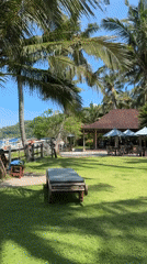 Resort guests enjoy tropical beach leisure in Karangasem Indonesia