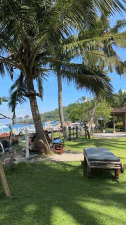 Resort guests enjoy tropical beach leisure in Karangasem Indonesia