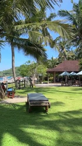 Resort guests enjoy tropical beach leisure in Karangasem Indonesia