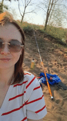 Woman enjoys leisurely fishing afternoon in Chaikovsky, Russia