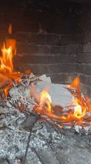Paper and cardboard burned in brick fireplace, Troyan Bulgaria