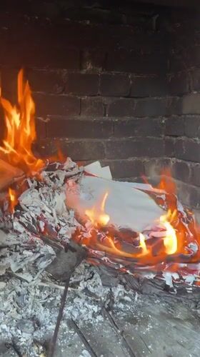 Paper and cardboard burned in brick fireplace, Troyan Bulgaria