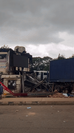 Truck-building collision in Jos amid everyday street activity