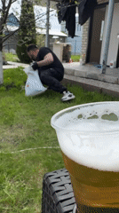 Backyard gathering features cooking, yard work, socializing on spring day