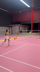 Badminton match captured on pink court in Ko Samui