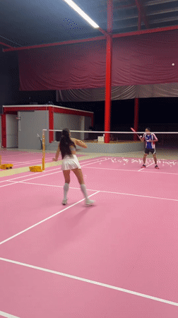 Badminton match captured on pink court in Ko Samui