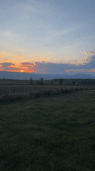Sunset documented over rural waterscape in Blagoevgrad, Bulgaria