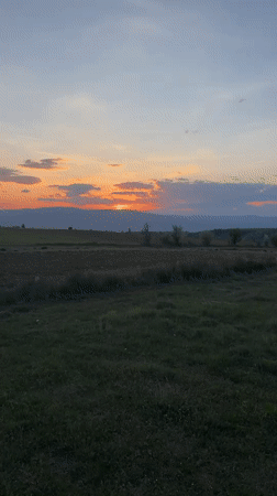 Sunset documented over rural waterscape in Blagoevgrad, Bulgaria