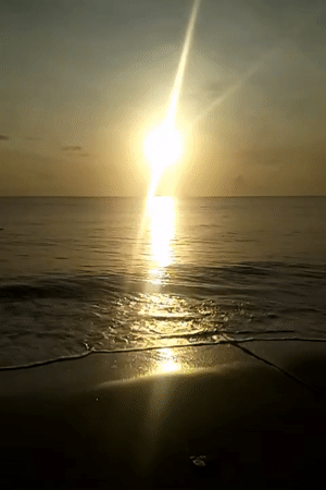 Sunrise captured by witnesses at Calok beach, Indonesia